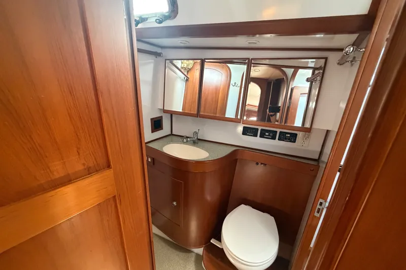 Slide: The Image of Luxurious wooden bathroom interior of 2009 Hylas 54 yacht with sink and toilet. - 13