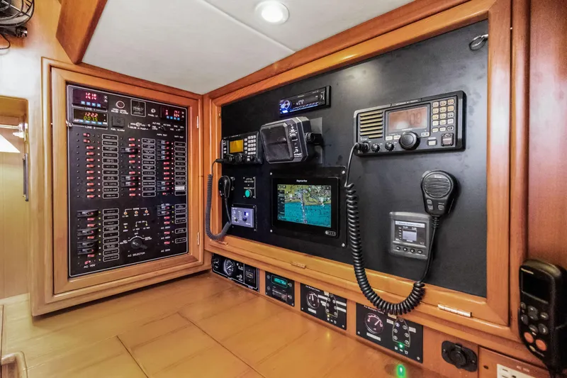 Slide: The Image of Navigation and control panel of a 2009 Hylas 54 yacht, featuring advanced electronics. - 11