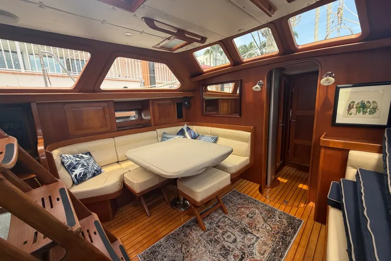 Slide: The Image of Luxurious 2009 Hylas 54 yacht interior with elegant wood finish and cozy seating area. - 8