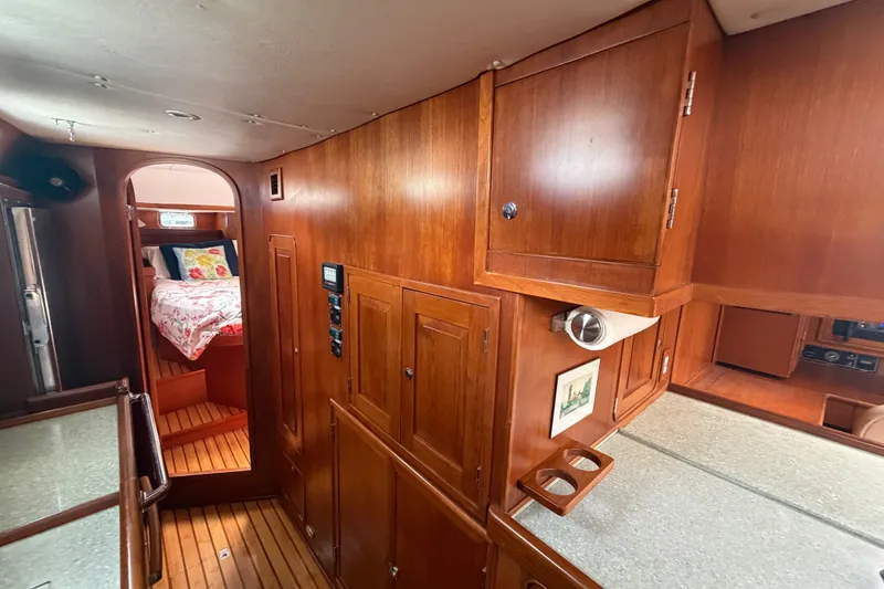 Slide: The Image of Interior of 2009 Hylas 54 yacht with wooden cabinetry and cozy bedroom. - 19