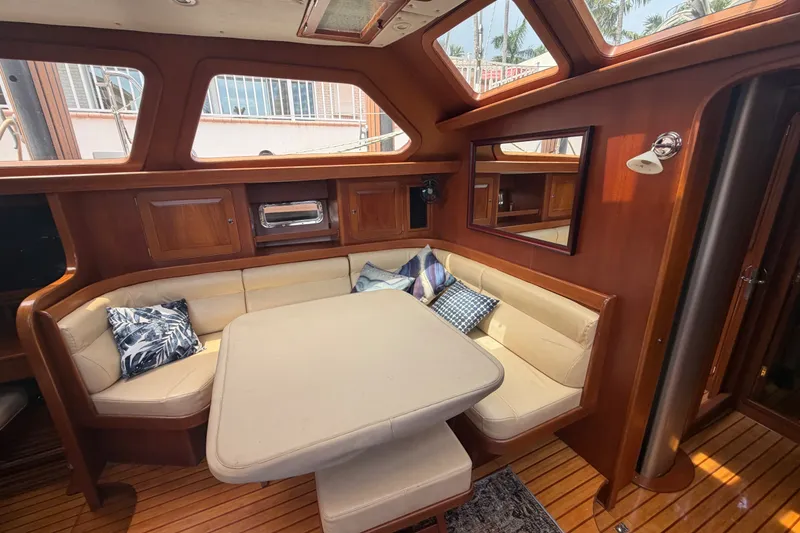 Slide: The Image of Luxurious interior of a 2009 Hylas 54 yacht with elegant wood finish and plush seating. - 25