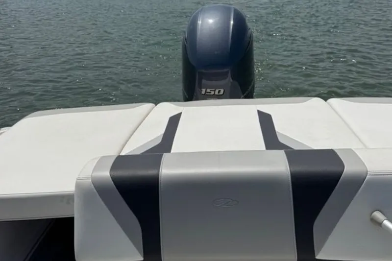 Slide: The Image of 2020 Regal 21 OBX boat with outboard motor on calm water. - 5