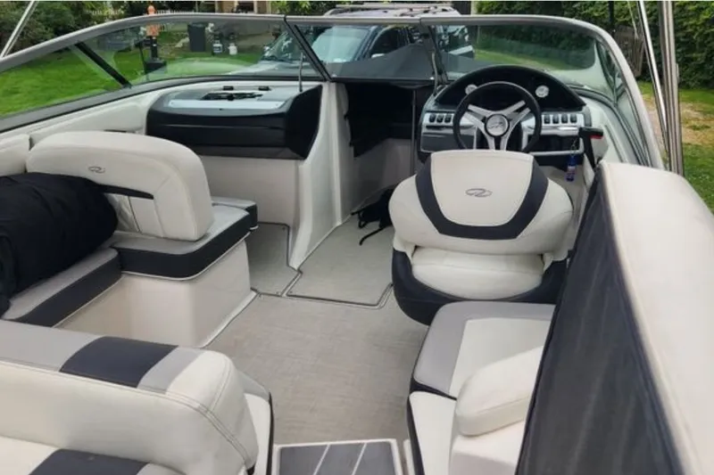 Slide: The Image of Interior of a 2020 Regal 21 OBX boat with plush seating and modern dashboard. - 6