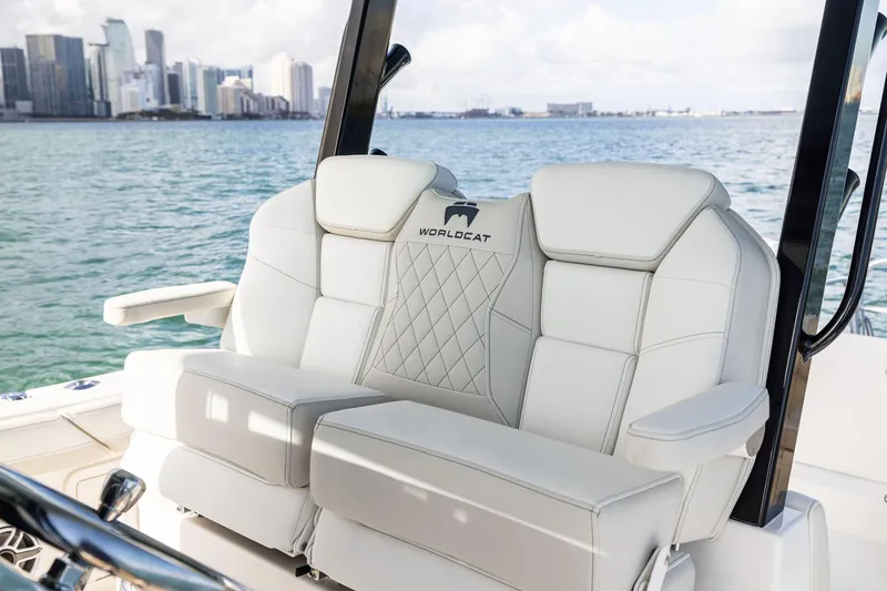 Slide: The Image of Luxury seating on 2026 World Cat 325CC boat with city skyline in background. - 25