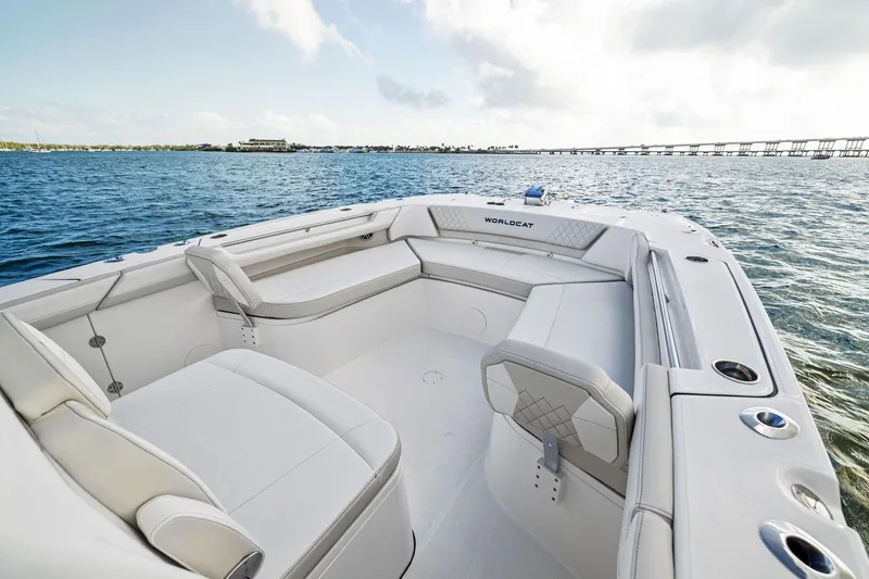 Slide: The Image of 2026 World Cat 325CC boat interior with spacious seating on open water. - 10