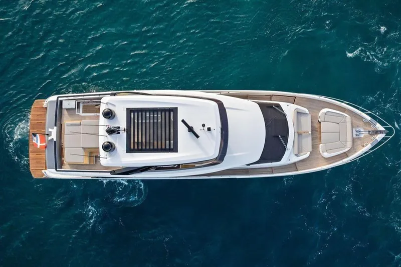 Slide: The Image of Aerial view of 2023 Ferretti Yachts 860 cruising on blue ocean waters. - 56