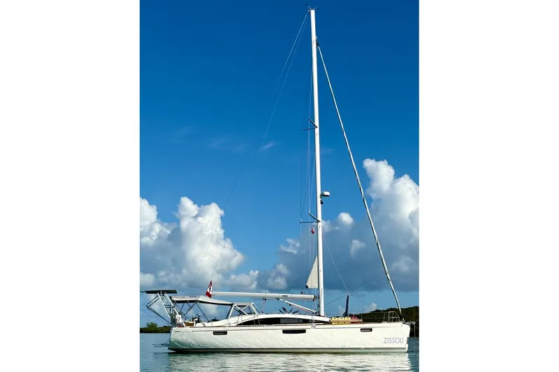 The Image of 2015 Bavaria Vision 46 sailboat on calm water under a clear blue sky. - 0