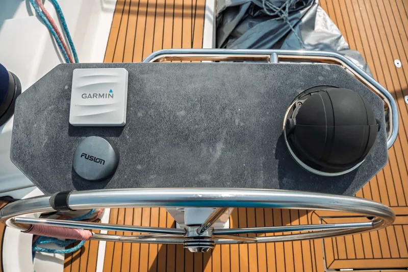 Slide: The Image of Steering wheel and navigation controls on a 2015 Bavaria Vision 46 yacht. - 14