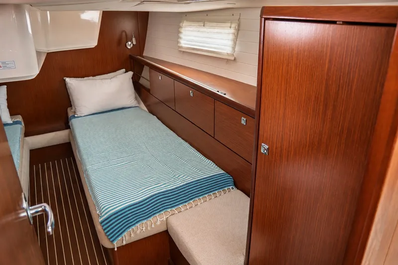 Slide: The Image of Cozy cabin interior of 2015 Bavaria Vision 46 yacht with wooden furnishings and twin beds. - 34