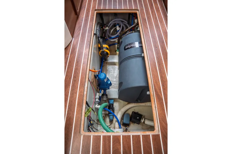 Slide: The Image of Engine compartment of 2015 Bavaria Vision 46 yacht, showcasing mechanical components and wiring. - 35