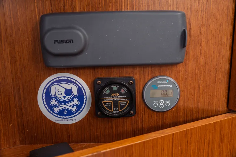 Slide: The Image of Control panel on Bavaria Vision 46 yacht, featuring Fusion audio, propane detector, and Victron Energy monitor. - 24