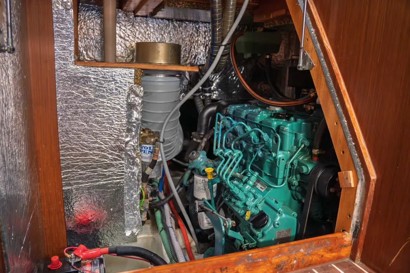 Slide: The Image of Engine compartment of a 2015 Bavaria Vision 46 sailboat, featuring a Volvo Penta engine. - 38