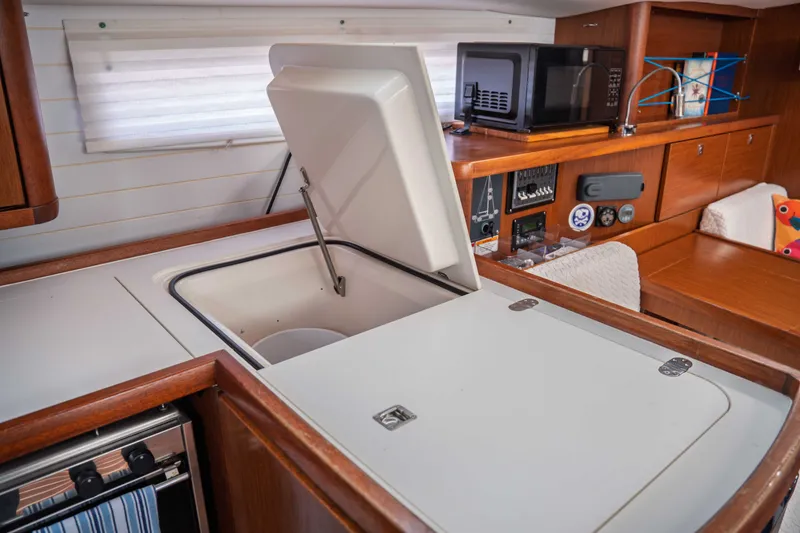 Slide: The Image of Interior of 2015 Bavaria Vision 46 yacht kitchen with open storage compartment. - 22