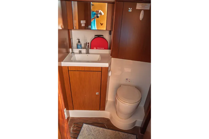 Slide: The Image of Bathroom interior of 2015 Bavaria Vision 46 yacht with sink, mirror, and toilet. - 32