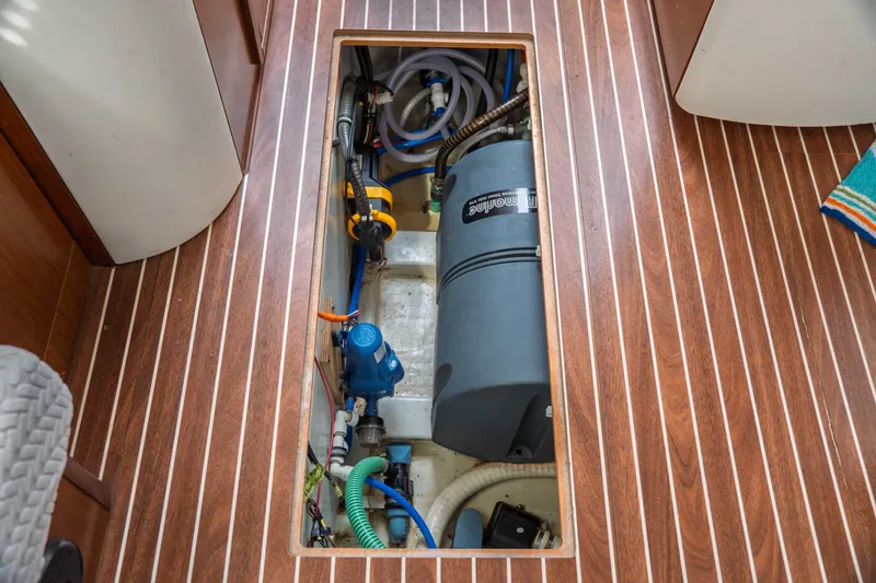 Slide: The Image of Engine compartment of a 2015 Bavaria Vision 46 yacht, showcasing mechanical components. - 36