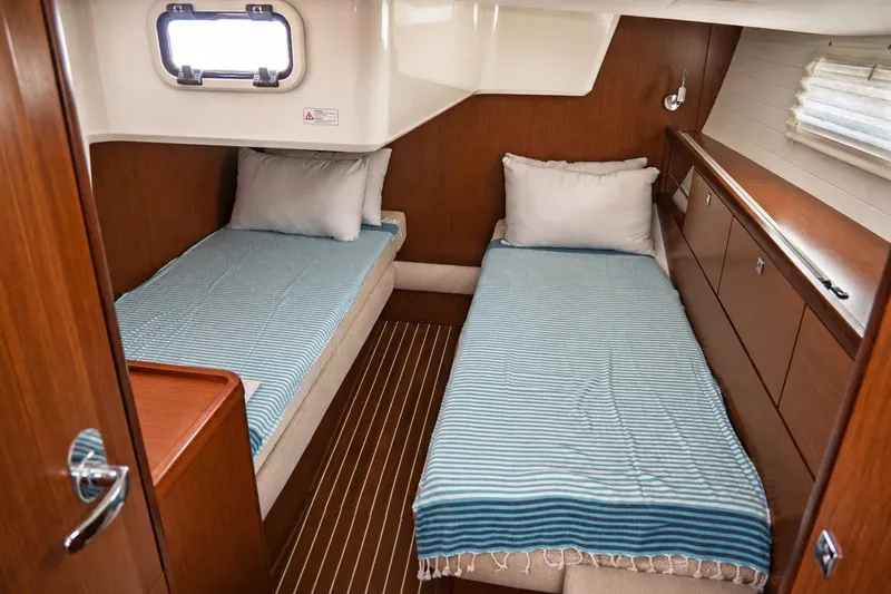 Slide: The Image of Interior cabin of 2015 Bavaria Vision 46 yacht with twin beds and wooden finish. - 33