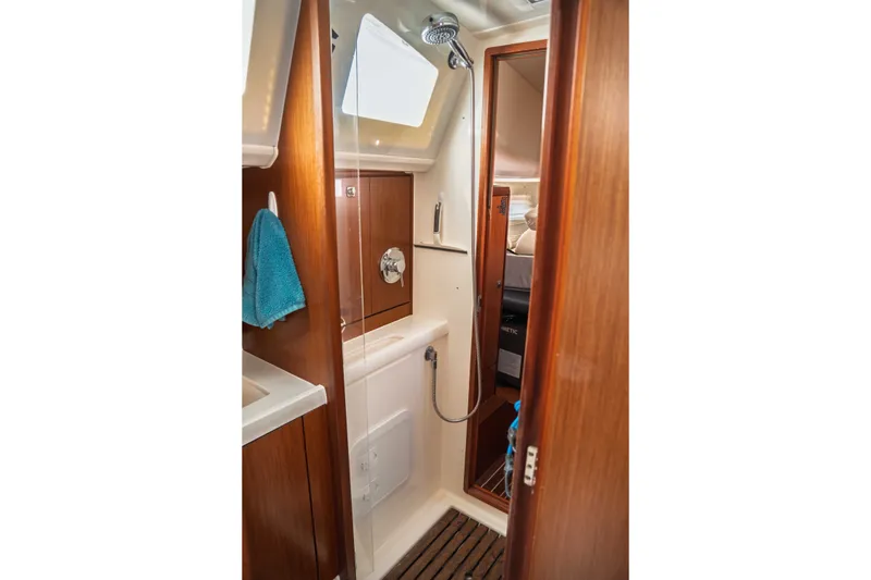 Slide: The Image of Interior of 2015 Bavaria Vision 46 yacht bathroom with wooden finishes and shower. - 28