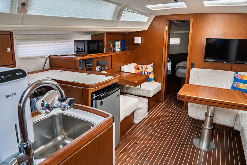 Slide: The Image of Interior of 2015 Bavaria Vision 46 yacht with modern kitchen and cozy seating area. - 21