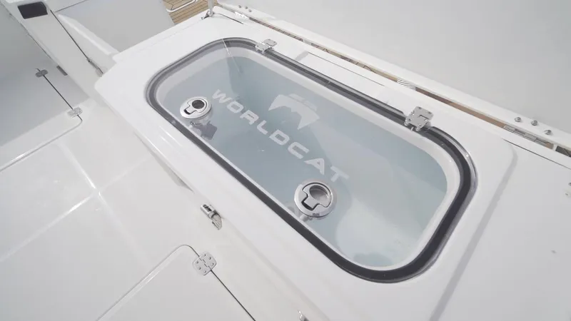 Slide: The Image of 2026 World Cat 400CC-X boat livewell with transparent lid and secure latches. - 27