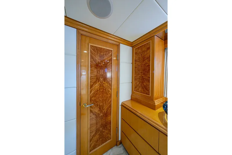 Slide: The Image of Luxurious wooden interior of 1997 Delta Marine Tri-deck Motoryacht, featuring elegant cabinetry and door design. - 36