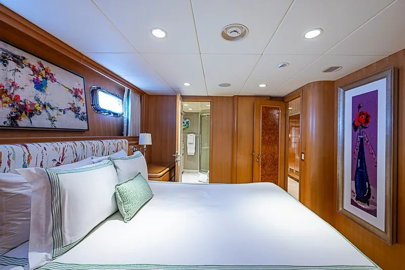Slide: The Image of Luxurious bedroom on 1997 Delta Marine Tri-deck Motoryacht with elegant decor and modern amenities. - 50