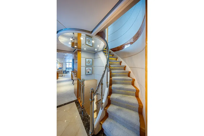 Slide: The Image of Luxurious interior staircase of 1997 Delta Marine Tri-deck Motoryacht with elegant design. - 21