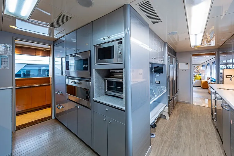 Slide: The Image of Luxurious kitchen interior of 1997 Delta Marine Tri-deck Motoryacht with modern appliances and sleek design. - 19