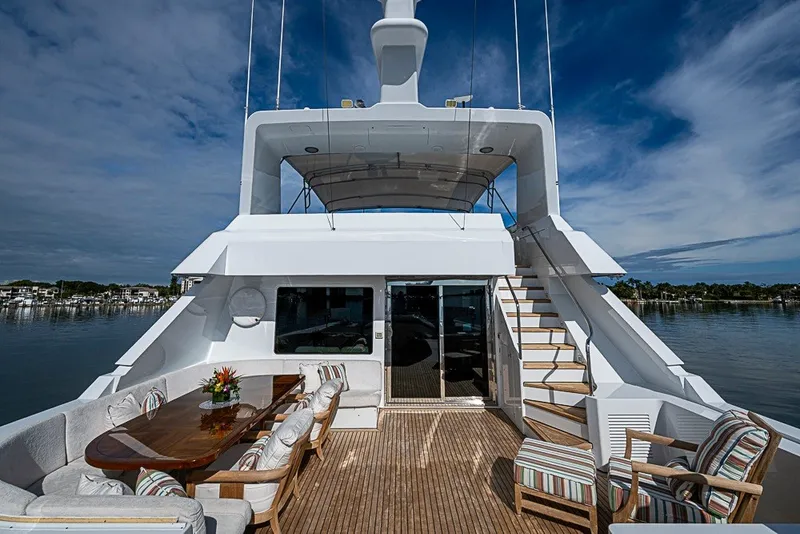 Slide: The Image of Luxurious 1997 Delta Marine Tri-deck Motoryacht with elegant outdoor seating and scenic views. - 73
