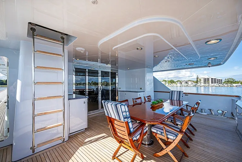 Slide: The Image of Luxurious 1997 Delta Marine Tri-deck Motoryacht with elegant outdoor dining area and scenic views. - 62