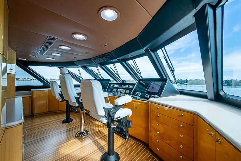 Slide: The Image of Luxurious helm of a 1997 Delta Marine Tri-deck Motoryacht with panoramic windows. - 27