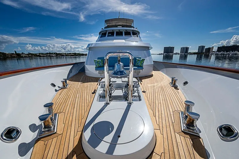 Slide: The Image of Luxurious 1997 Delta Marine Tri-deck Motoryacht with sleek wooden deck and scenic waterfront view. - 67