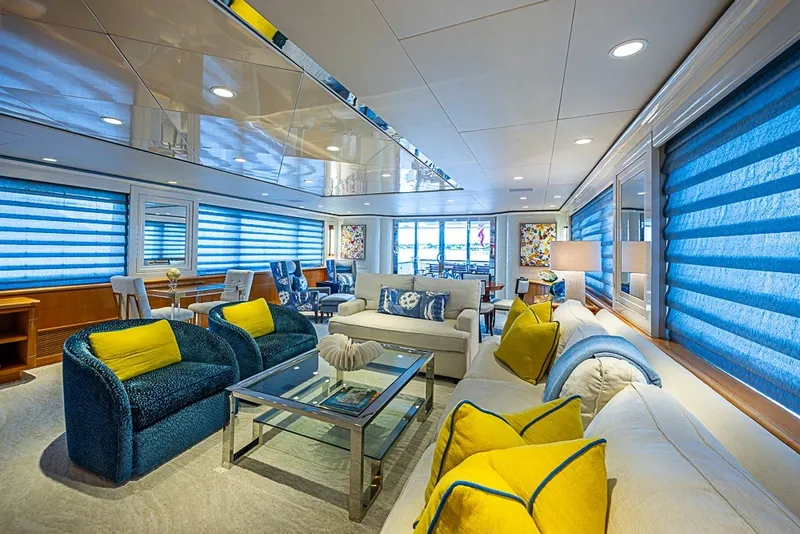 Slide: The Image of Luxurious interior of 1997 Delta Marine Tri-deck Motoryacht with vibrant blue and yellow decor. - 6