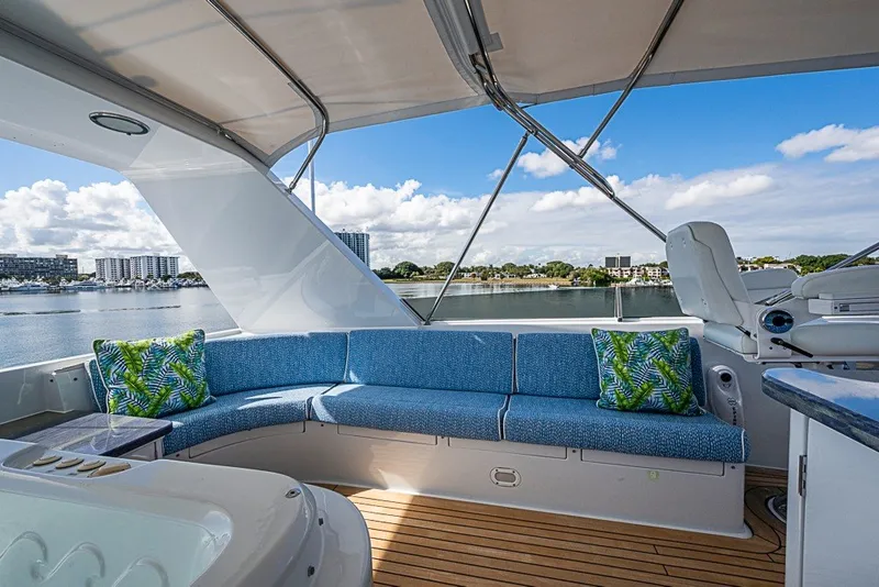 Slide: The Image of Luxurious 1997 Delta Marine Tri-deck Motoryacht with spacious deck seating and scenic waterfront view. - 75