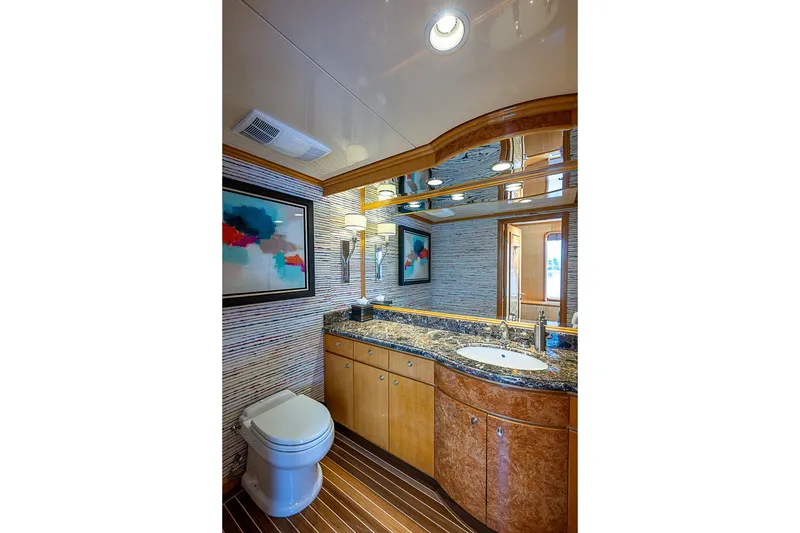 Slide: The Image of Luxurious bathroom on 1997 Delta Marine Tri-deck Motoryacht with elegant wood and marble finishes. - 26
