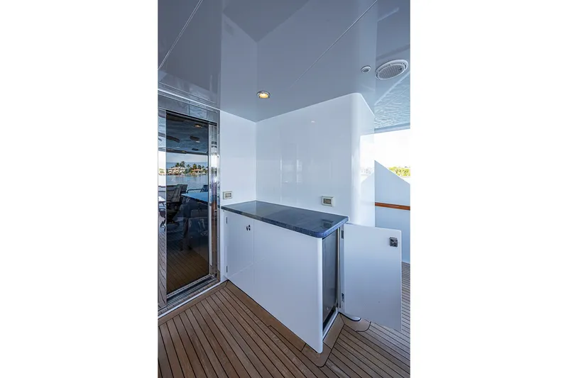 Slide: The Image of Luxurious Delta Marine Tri-deck Motoryacht interior, featuring sleek cabinetry and elegant wood flooring, 1997 model. - 63