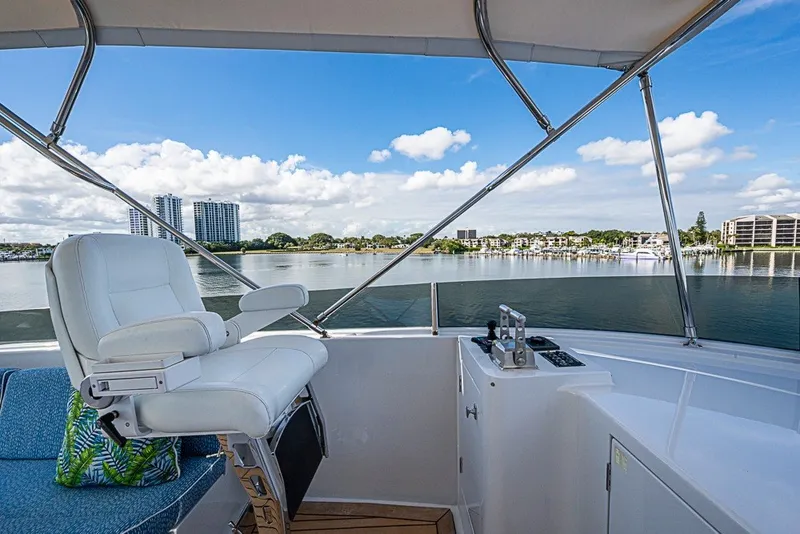 Slide: The Image of Luxurious Delta Marine Tri-deck Motoryacht helm with scenic waterfront view, 1997 model. - 78