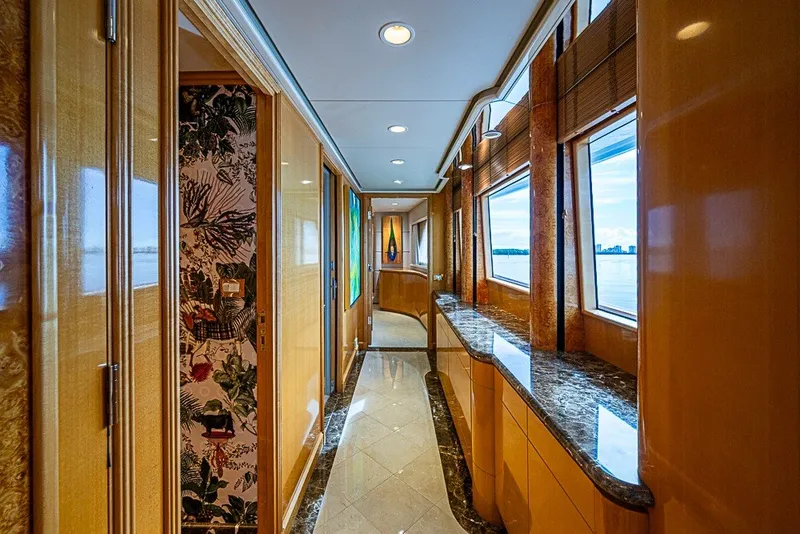 Slide: The Image of Luxurious interior hallway of 1997 Delta Marine Tri-deck Motoryacht with elegant wood and marble finishes. - 13