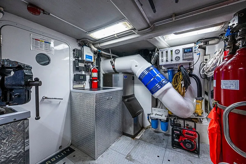 Slide: The Image of Engine room of 1997 Delta Marine Tri-deck Motoryacht with equipment and safety features. - 87