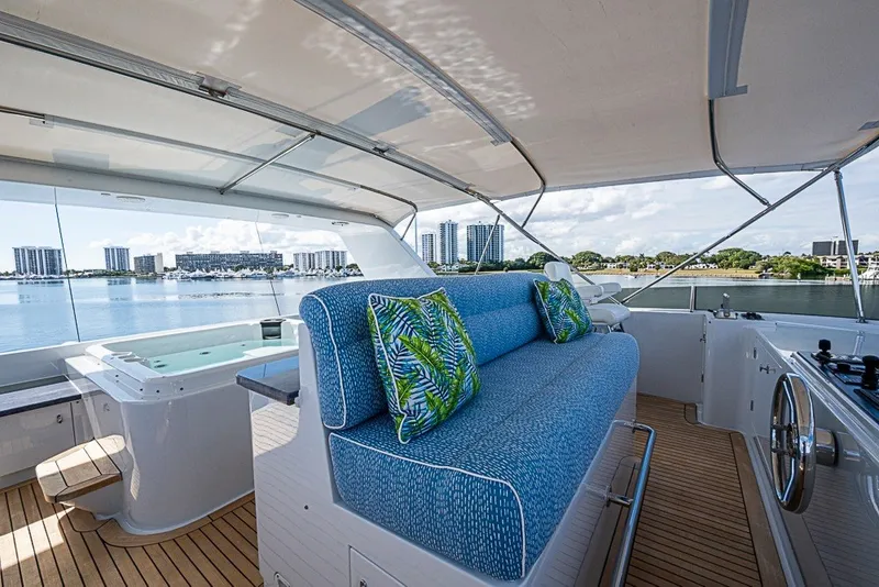 Slide: The Image of Luxurious 1997 Delta Marine Tri-deck Motoryacht with spacious deck, seating, and scenic waterfront view. - 77