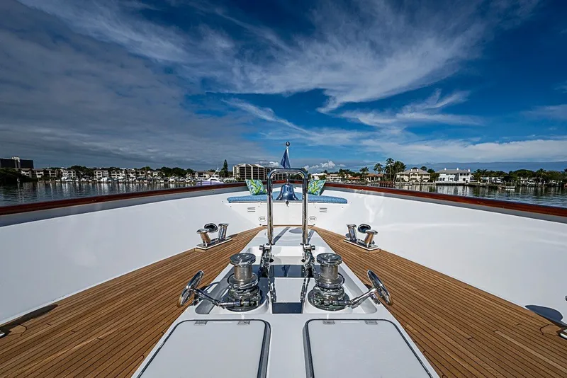 Slide: The Image of Luxurious 1997 Delta Marine Tri-deck Motoryacht with teak deck and scenic waterfront view. - 66