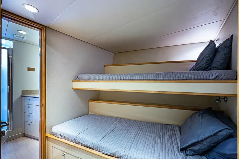 Slide: The Image of Bunk beds in a 1997 Delta Marine Tri-deck Motoryacht cabin with adjacent bathroom. - 52