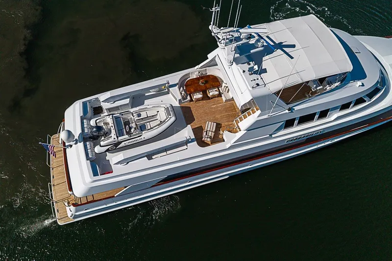 Slide: The Image of Aerial view of 1997 Delta Marine Tri-deck Motoryacht cruising on water. - 92