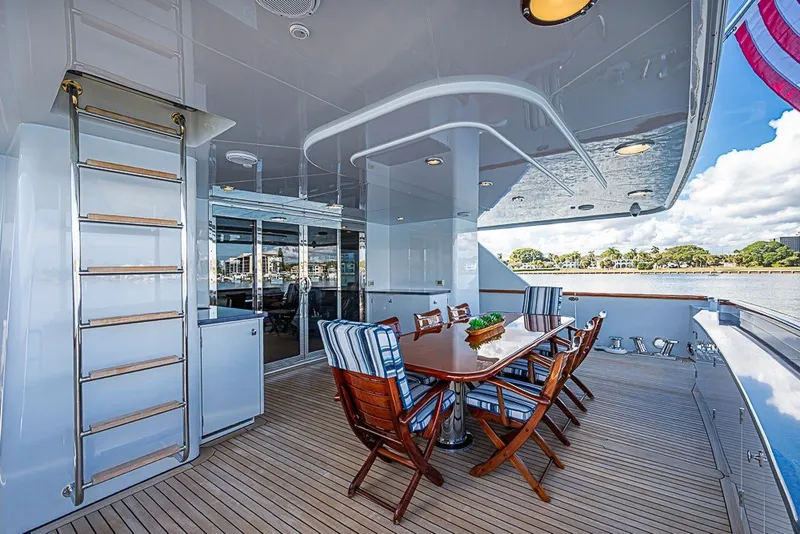 Slide: The Image of Luxurious 1997 Delta Marine Tri-deck Motoryacht with elegant outdoor dining area and ocean view. - 64