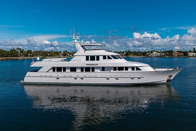 Slide: The Image of Delta Marine 1997 Tri-deck Motoryacht on serene water under a clear blue sky. - 88