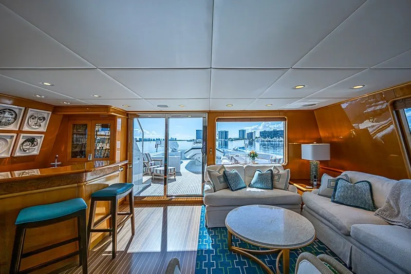 Slide: The Image of Luxurious interior of 1997 Delta Marine Tri-deck Motoryacht with elegant seating and bar area. - 24