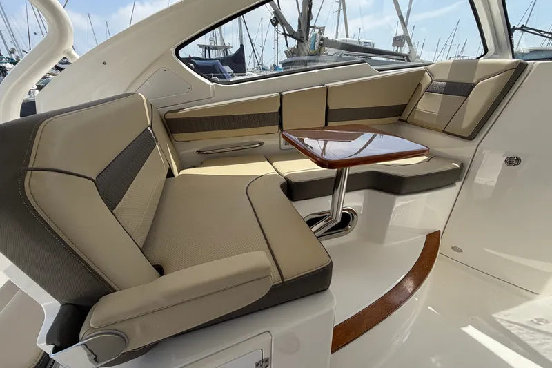 Slide: The Image of Luxurious seating area on a 2019 Pursuit DC 365 Dual Console boat. - 39