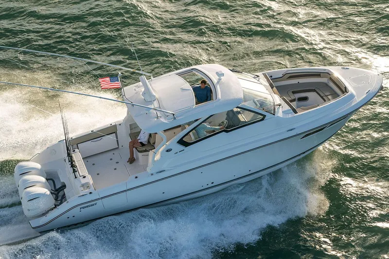 Slide: The Image of Manufacturer Provided Image: 2019 Pursuit DC 365 Dual Console boat cruising on water. - 80