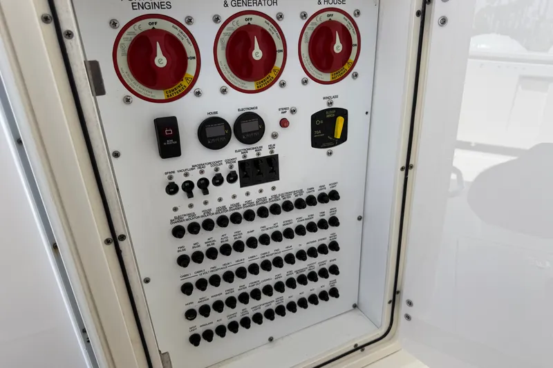 Slide: The Image of Electrical control panel on a 2019 Pursuit DC 365 Dual Console boat. - 22