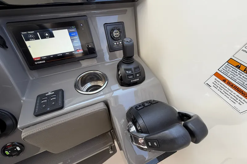 Slide: The Image of 2019 Pursuit DC 365 Dual Console boat dashboard with Yamaha controls and display. - 31