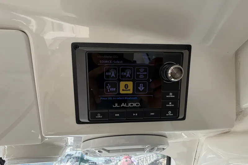 Slide: The Image of JL Audio MediaMaster control panel on 2019 Pursuit DC 365 Dual Console boat. - 33